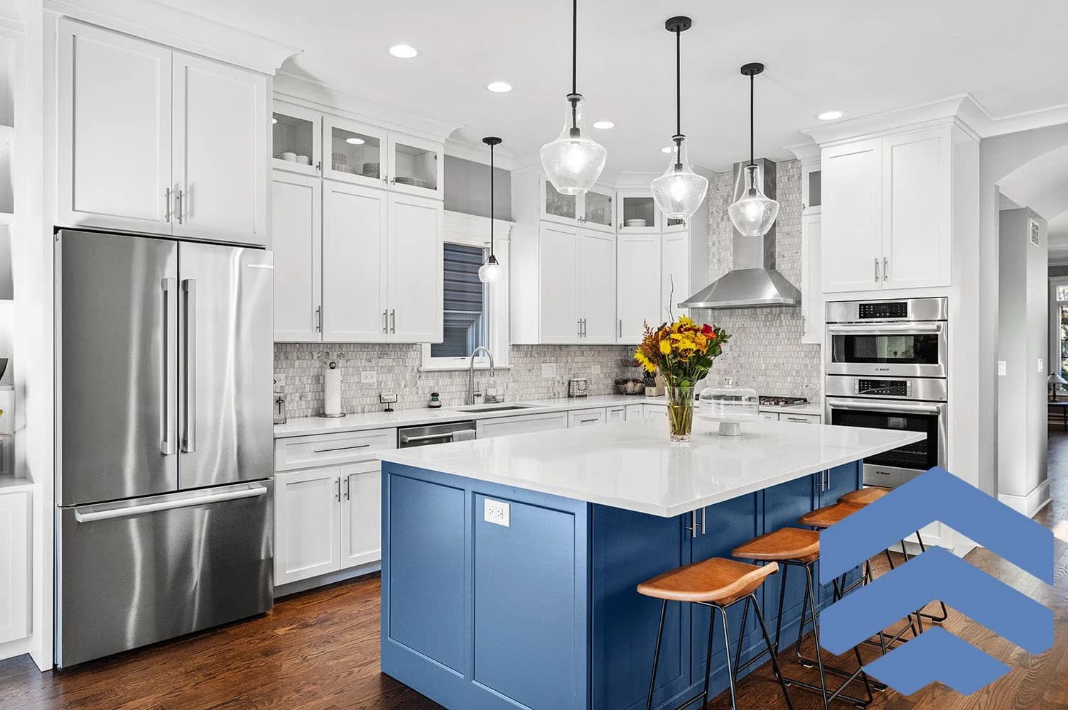 Bathroom renovation with blue-accented finishes and crisp tile work