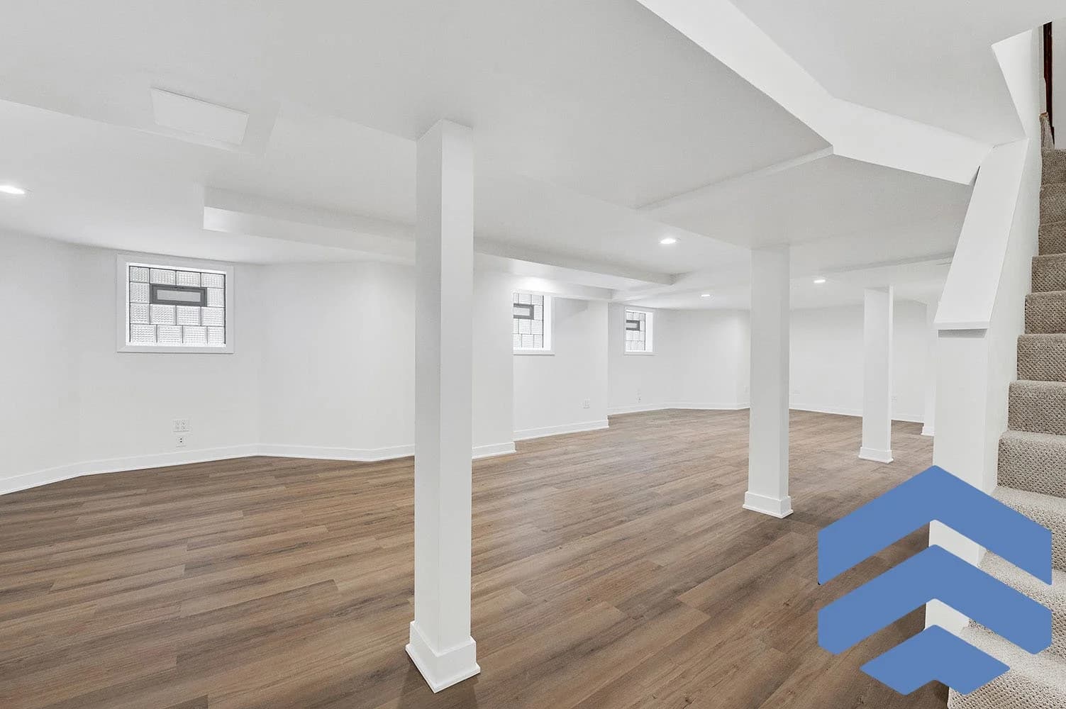 Queens basement renovation with updated flooring and recessed lighting