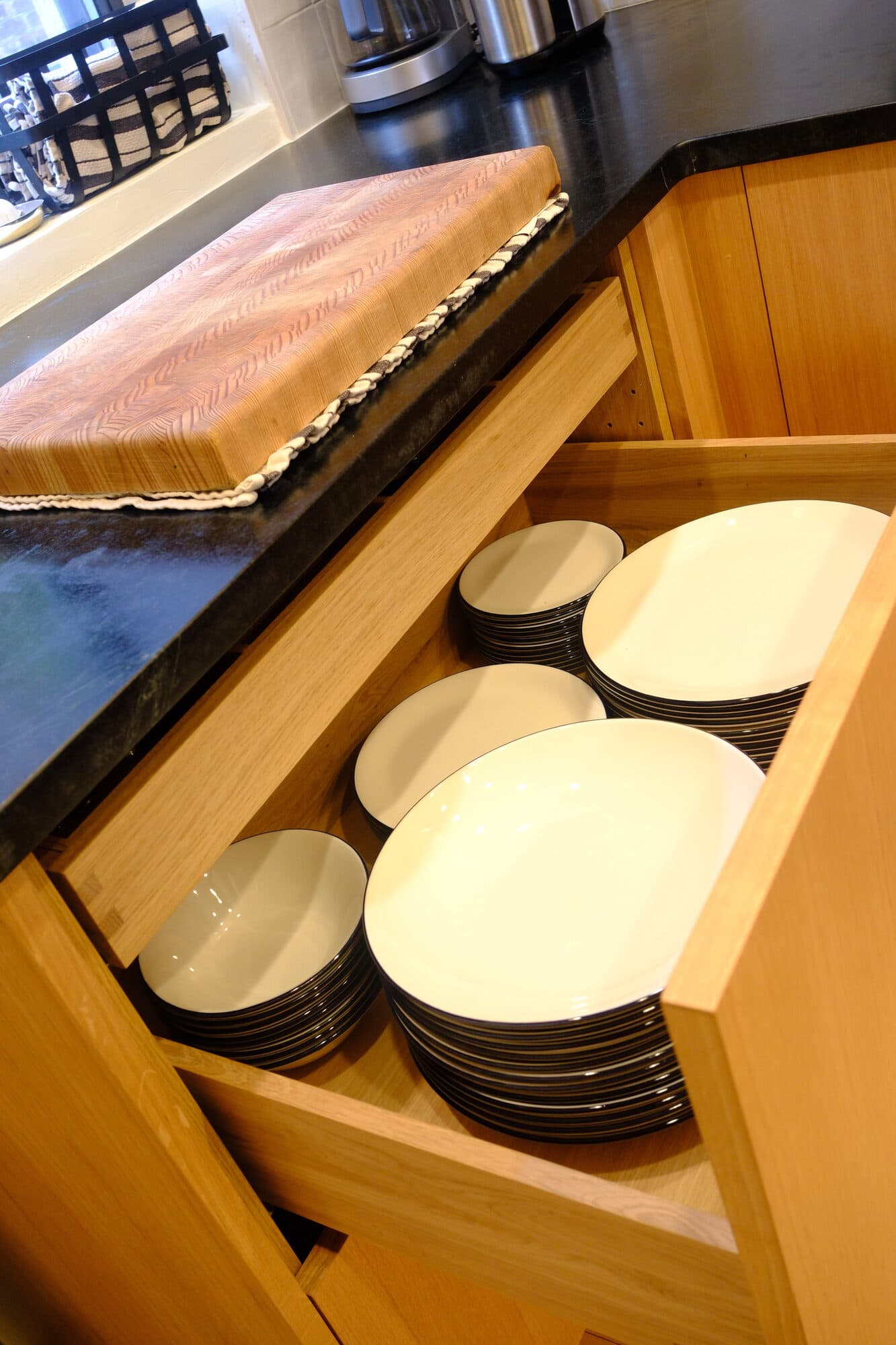 Custom plate-organizer drawer built into the kitchen cabinetry
