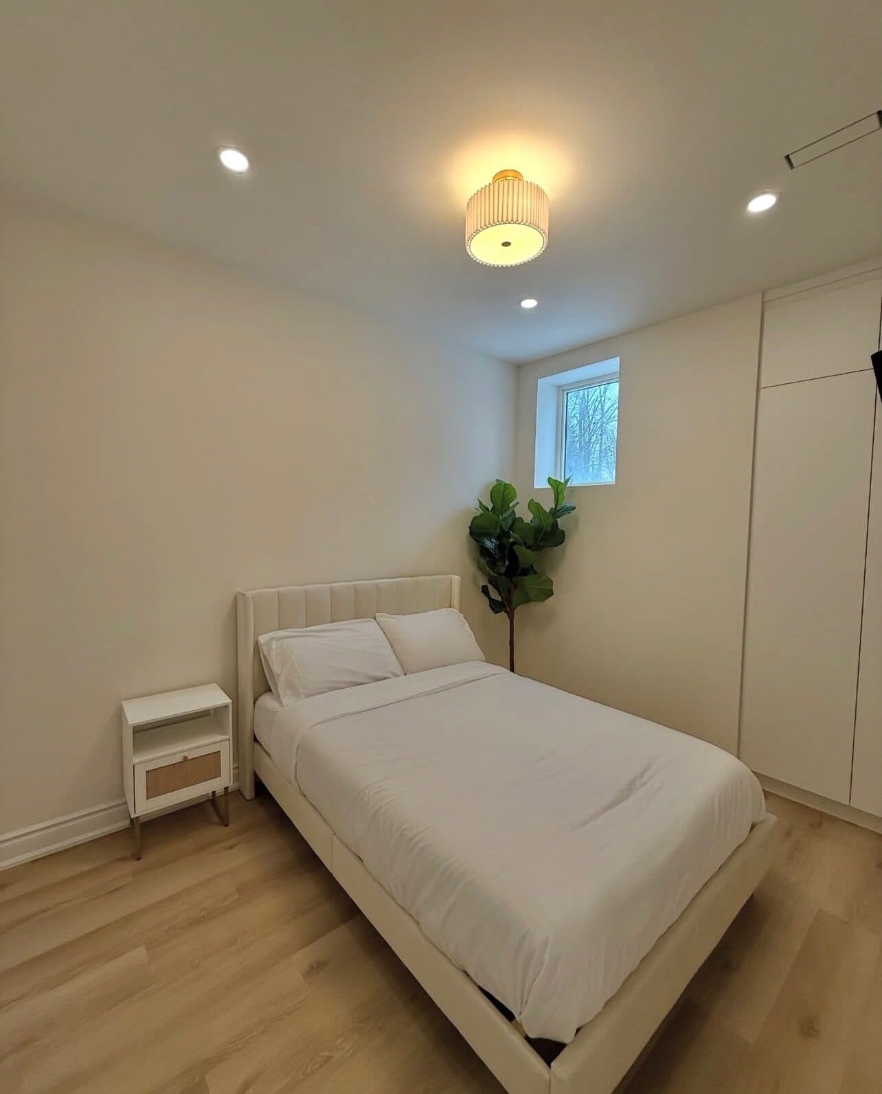 Bedroom with recessed lighting after the renovation