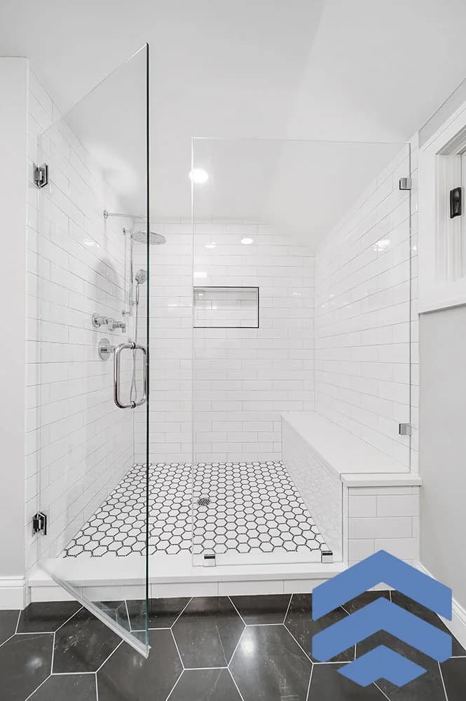 Bathroom renovation with marble-inspired tile and hex detailing