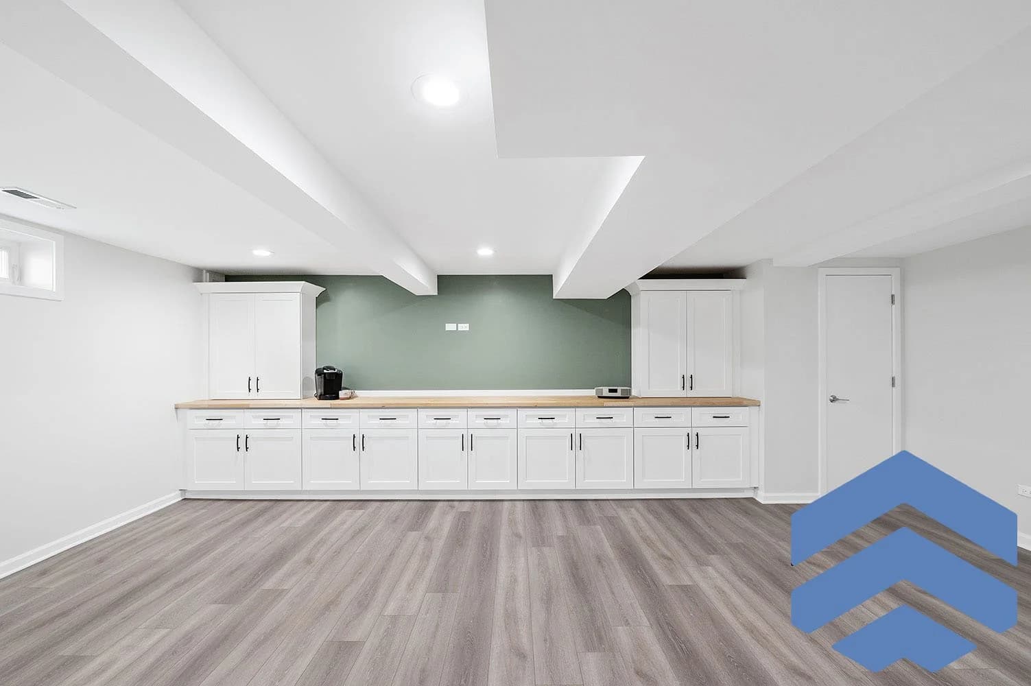 Minimal bathroom renovation with a soft green and neutral palette